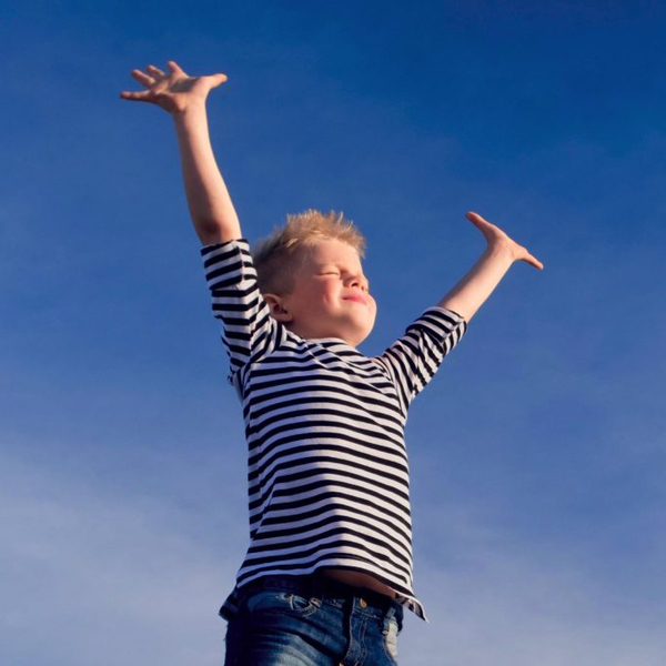 child taking breath with arms raised